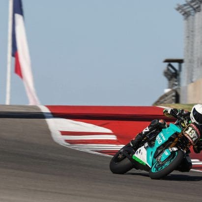 An electric superbike on a race track.