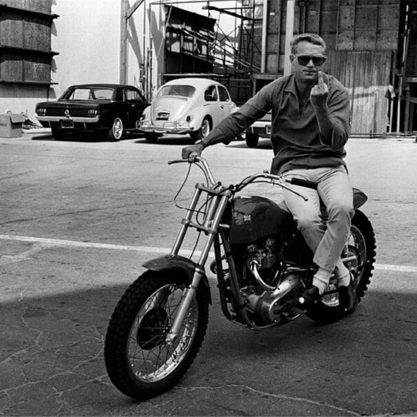 Steve McQueen on his Metisse Desert Racer in a Hollywood lot car park